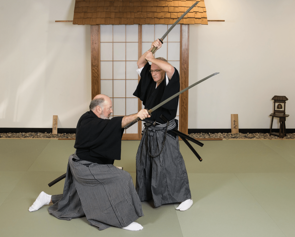 International Budo Renmei martial arts studnets sparring with swords